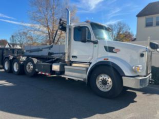 2023 Peterbilt 567 Tri-Axle Roll-Off Truck