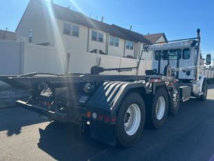 2023 Peterbilt 567 Tri-Axle Roll-Off Truck