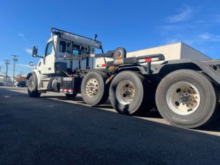 2023 Peterbilt 567 Tri-Axle Roll-Off Truck