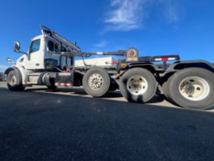 2023 Peterbilt 567 Tri-Axle Roll-Off Truck